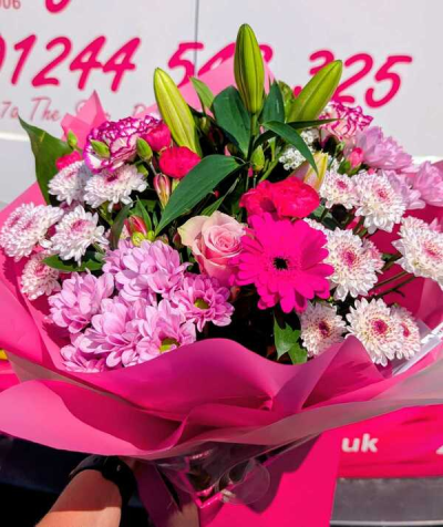 Pretty in Pink - A vibrant hand-tied bouquet of fresh seasonal blooms in rich pink, soft blush and crisp white tones, beautifully arranged to celebrate any special occasion.