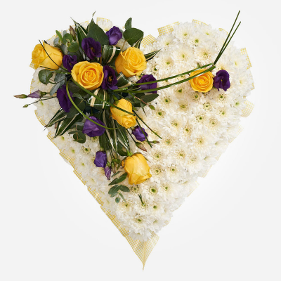 Treasured Memories Heart - A beautifully handcrafted heart-shaped tribute featuring fresh seasonal blooms in soft white, golden yellow and rich purple tones, creating a heartfelt expression of love and remembrance.